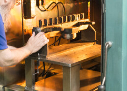 Electron beam welding technician preparing a vacuum chamber.